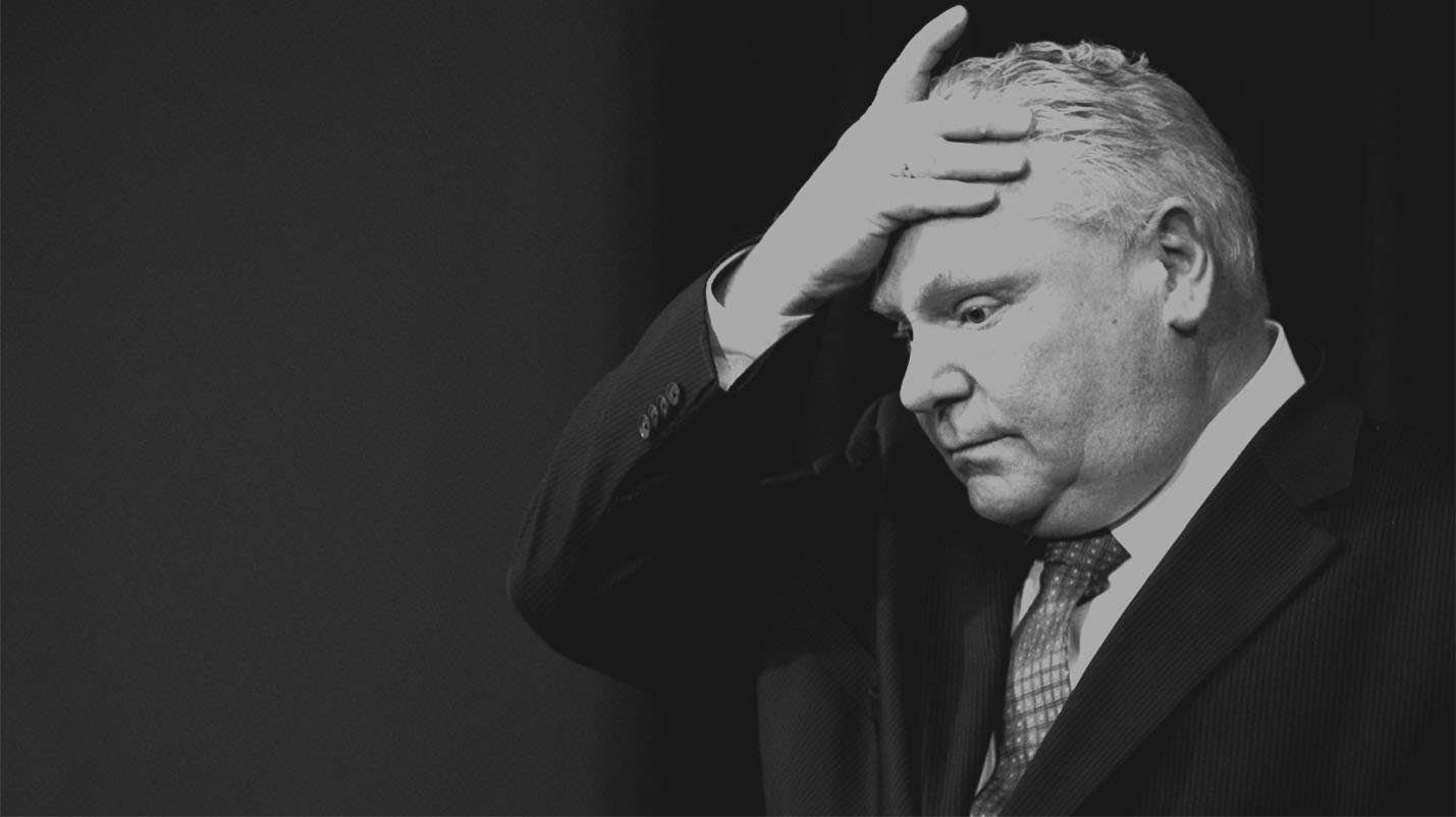 Premier Doug Ford with his hand on his forehead
